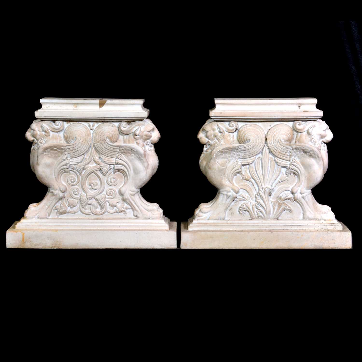 Lot 492 - Pair of composite bench ends designed with griffin