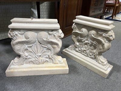 Lot 492 - Pair of composite bench ends designed with griffin