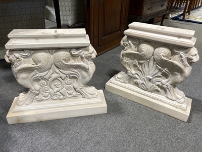 Lot 492 - Pair of composite bench ends designed with griffin