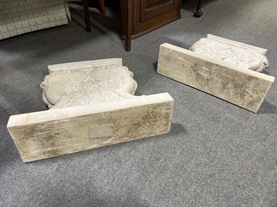 Lot 492 - Pair of composite bench ends designed with griffin