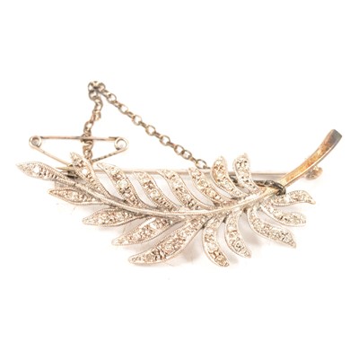 Lot 201 - A diamond feather brooch.