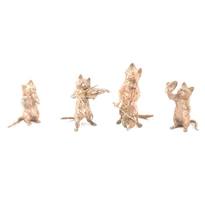 Lot 415 - Four novelty silver cats playing musical instruments.