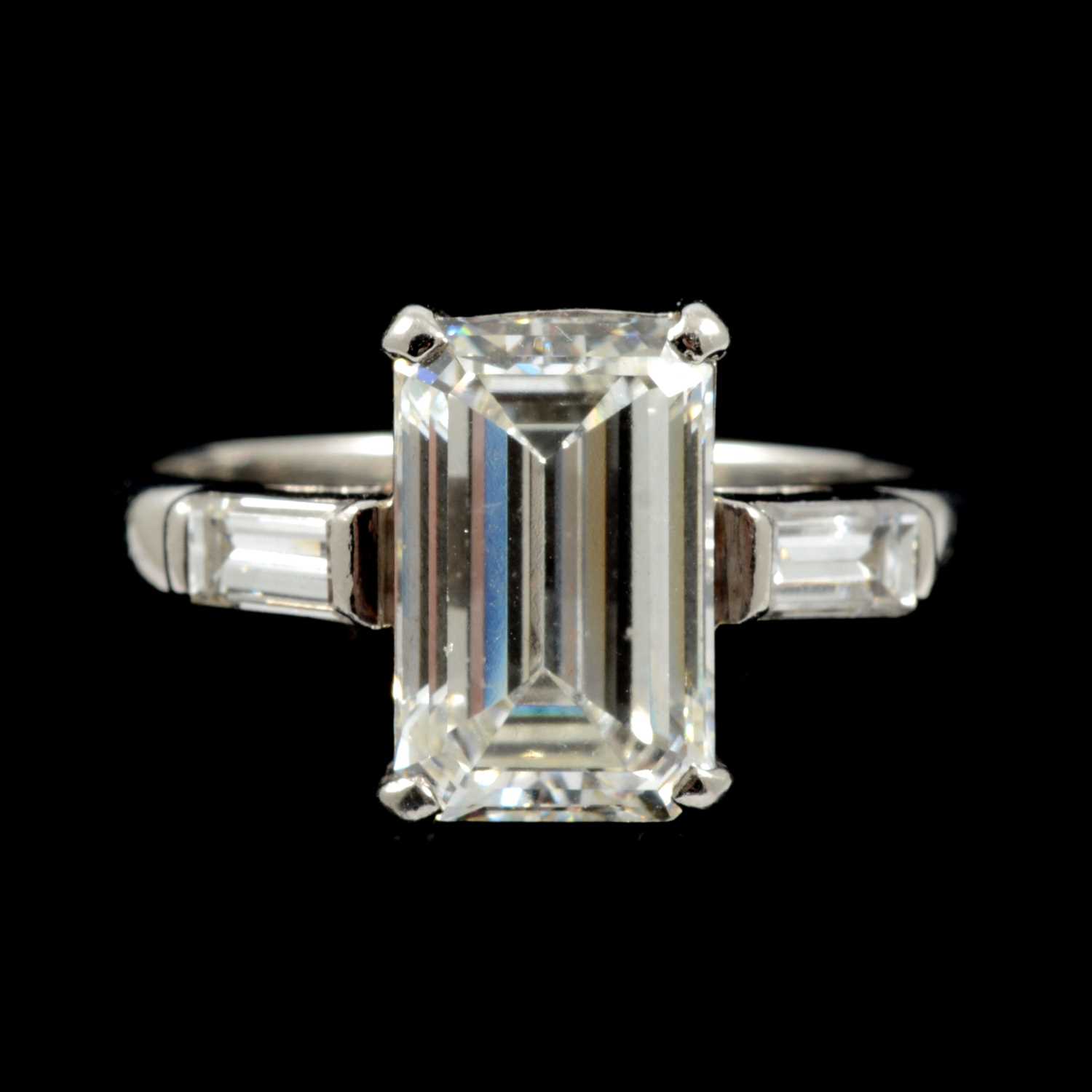 15 - A diamond solitaire ring, emerald step cut stone, 2.62 carats.