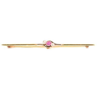 Lot 206 - A diamond and pink stone bar brooch.