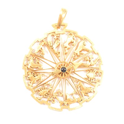 Lot 230 - A Garrard & Co 18 carat gold zodiac pendant.