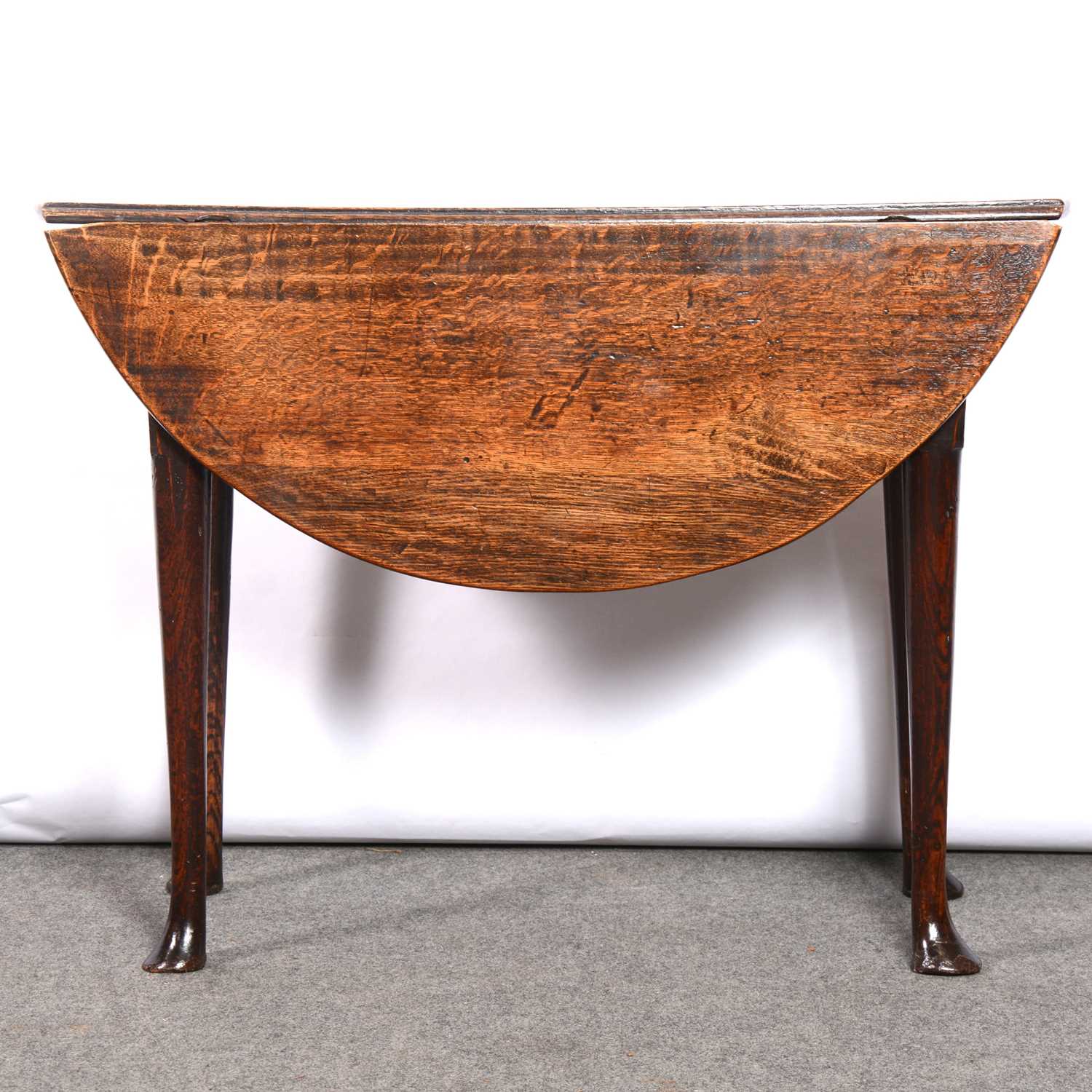 Lot 319 - George III oak dropleaf table,