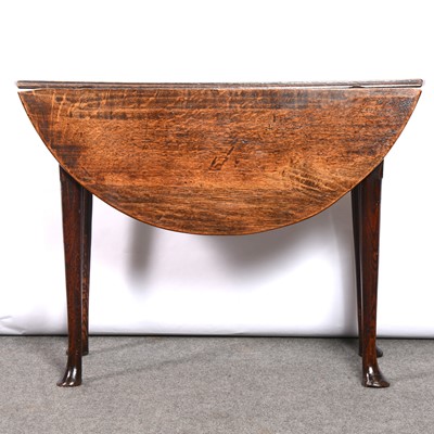 Lot 319 - George III oak dropleaf table