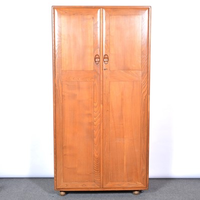 Lot 376 - An Ercol wardrobe and a chest of drawers