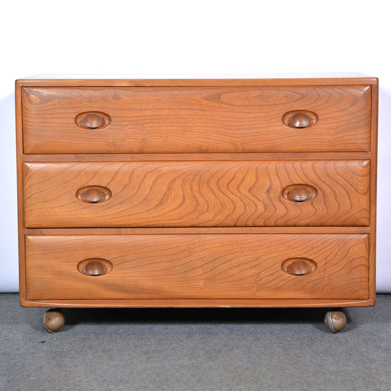 Lot 376 - An Ercol wardrobe and a chest of drawers