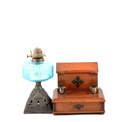 Lot 219 - Edwardian oak desk stand, and an oil lamp