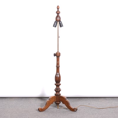 Lot 471 - An adjustable standard lamp and a walnut magazine table