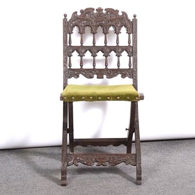 Lot 426 - Carved oak folding chair