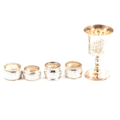 Lot 235 - Silver commemorative goblet, Michael Jones Jeweller, London 1975, and four silver napkin rings.