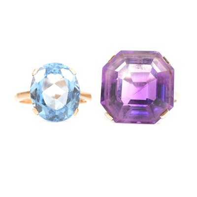 Lot 98 - An amethyst dress ring and a heat treated blue topaz ring.
