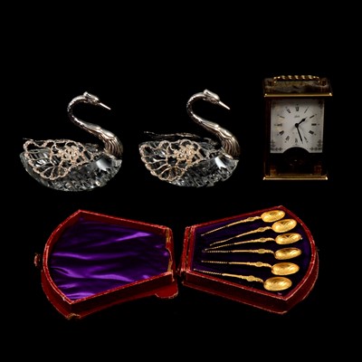 Lot 161 - Pair of cut glass and Continental silver swans, set of gilt metal teaspoons, and a carriage clock