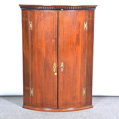 Lot 486 - George III mahogany bowfront hanging cupboard