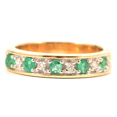 Lot 58 - Two eternity rings, emerald, sapphire and diamond.