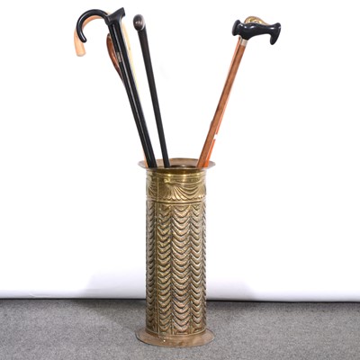 Lot 395 - Small collection of walking sticks, in a brass stick stand.