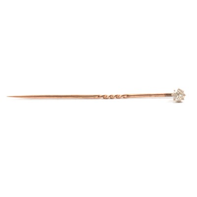 Lot 260 - A diamond set stick pin.