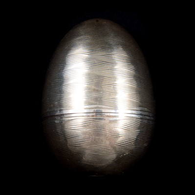 Lot 416 - A Nicholas Plummer silver surprise egg in the manner of Stuart Devlin.