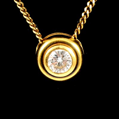 Lot 232 - A diamond solitaire pendant and chain.