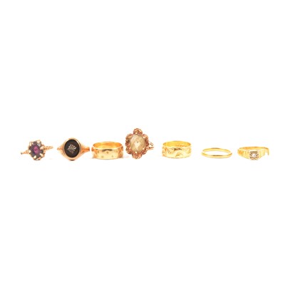 Lot 109 - Three gold wedding bands, and four gem set rings.