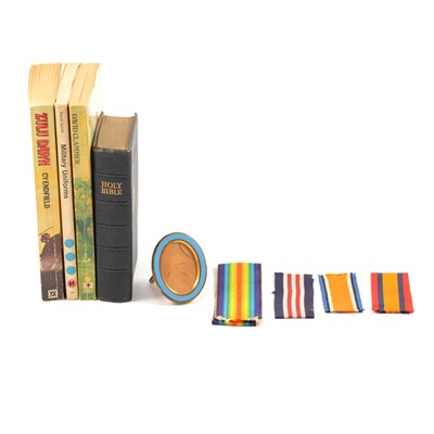 Lot 176 - Box of containing books, military cap badges and medal ribbons.