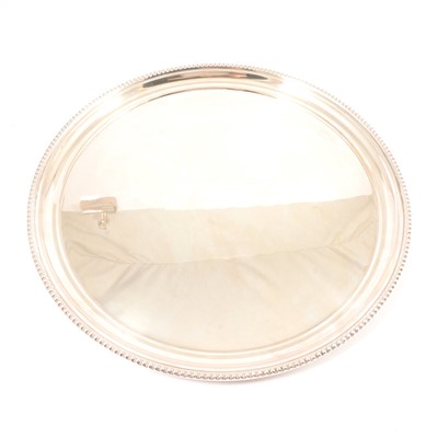 Lot 189 - A Walker & Hall circular silver-plated tray, another, and a twin-handled tray.