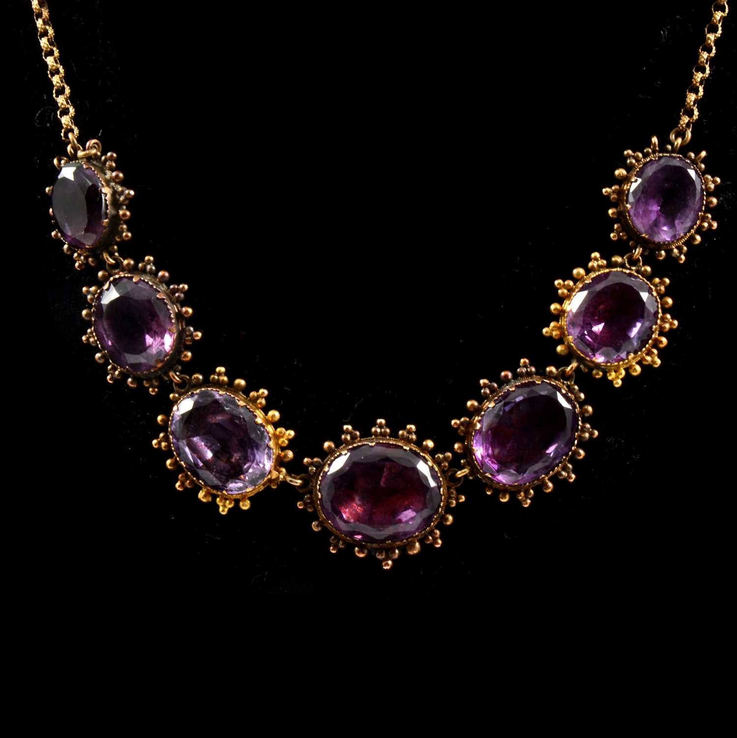 Lot 224 - A foil back amethyst necklace.