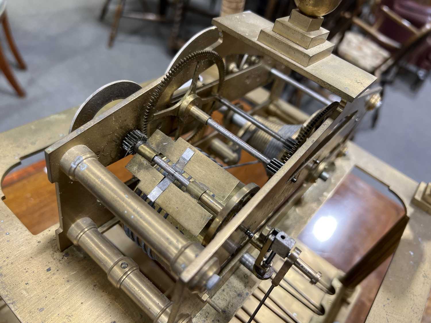 Lot 123 Congreve brass rolling ball clock,