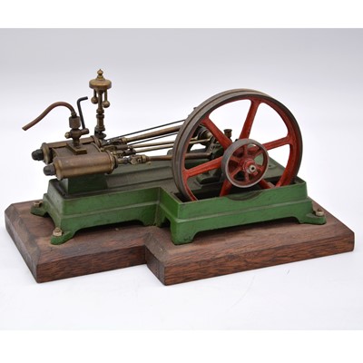 Lot 89 - A well-made horizonal steam mill engine, on wooden base, length 20cm.