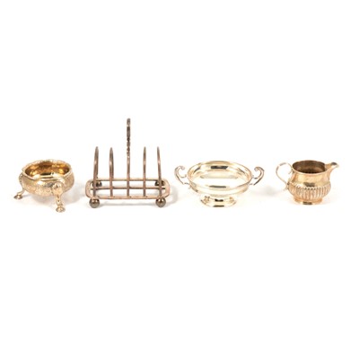 Lot 243 - Silver toast rack, Goldsmiths & Silversmiths Co Ltd, London 1927, and other small silver items.