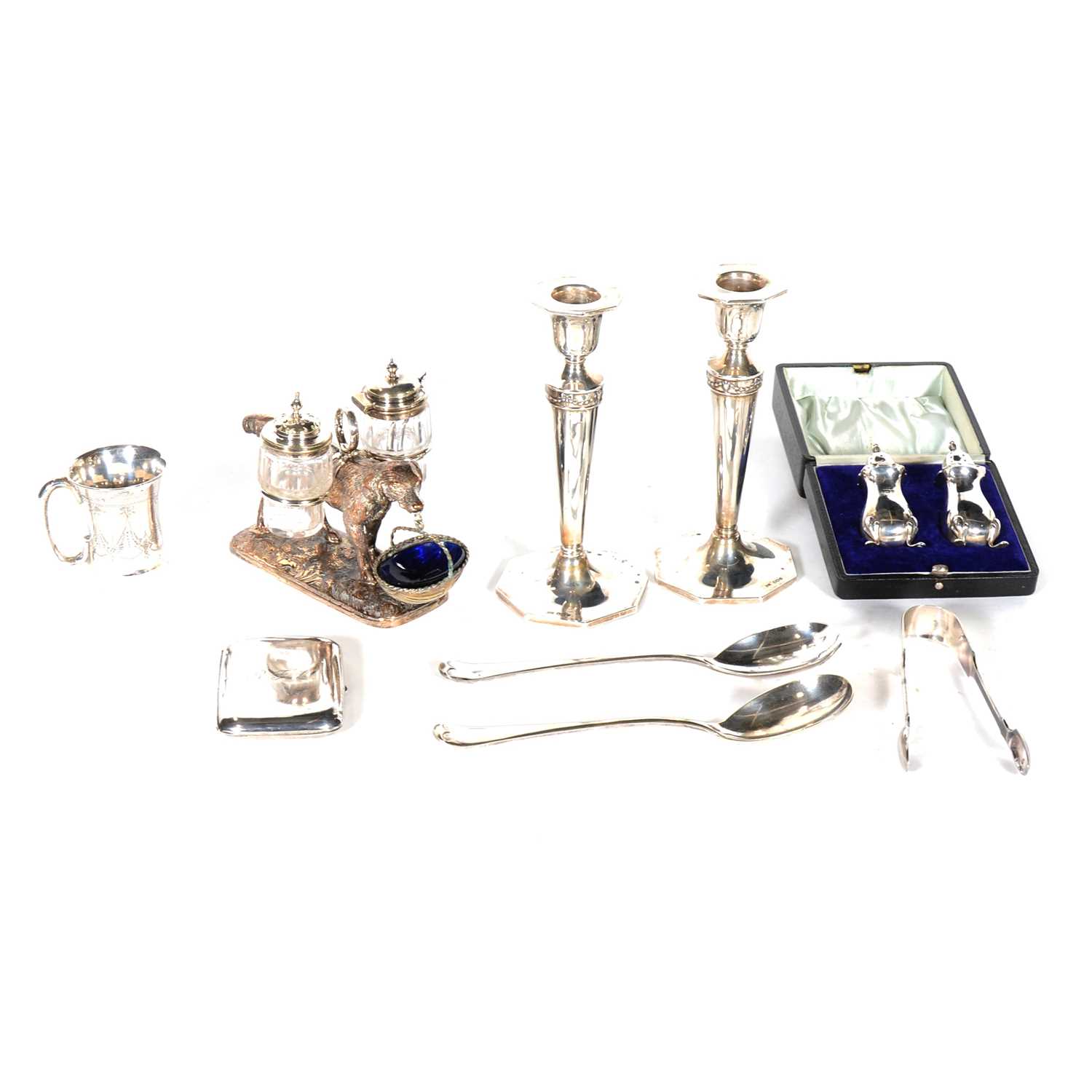 Lot 178 - A pair of silver candlesticks, christening mug, condiment set, cruet stand with retriever, plated ware.