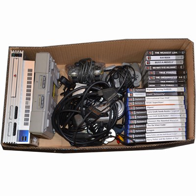 Lot 1214 - Sony PlayStation One and PS2 games consoles, with a selection of games and controllers.