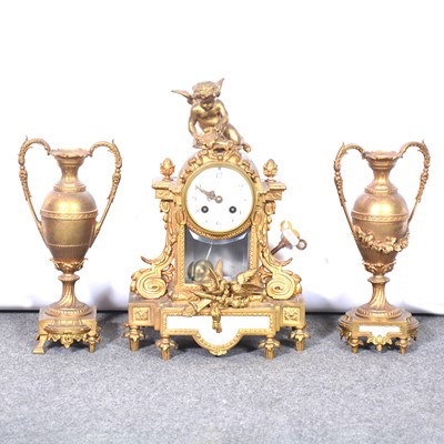 Lot 576 - French gilt metal clock garniture