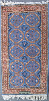 Lot 654 - Pair of Persian pattern blue ground rugs, and two other rugs