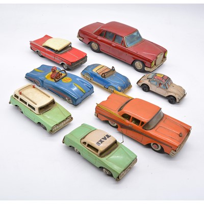 Lot 1025 - Eight tin-plate toy cars, some made in Japan.