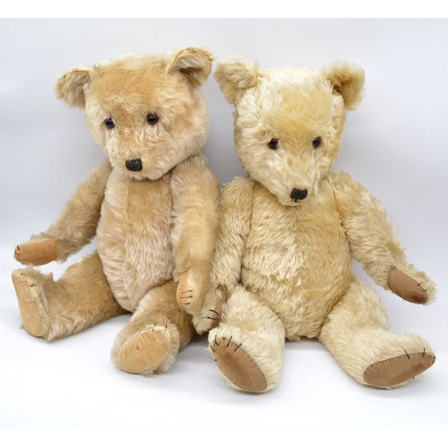 A mohair growler teddy bear, mid-20th century, possibly Chad Valley, with stitched snout and jointed A mohair growler teddy bear, mid-20th century, possibly Chad Valley, with stitched snout and jointed
