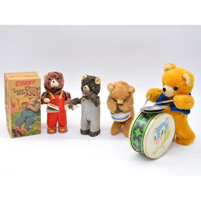 Lot 1007 - Four wind-up bear toys including Alps The Reading Bear