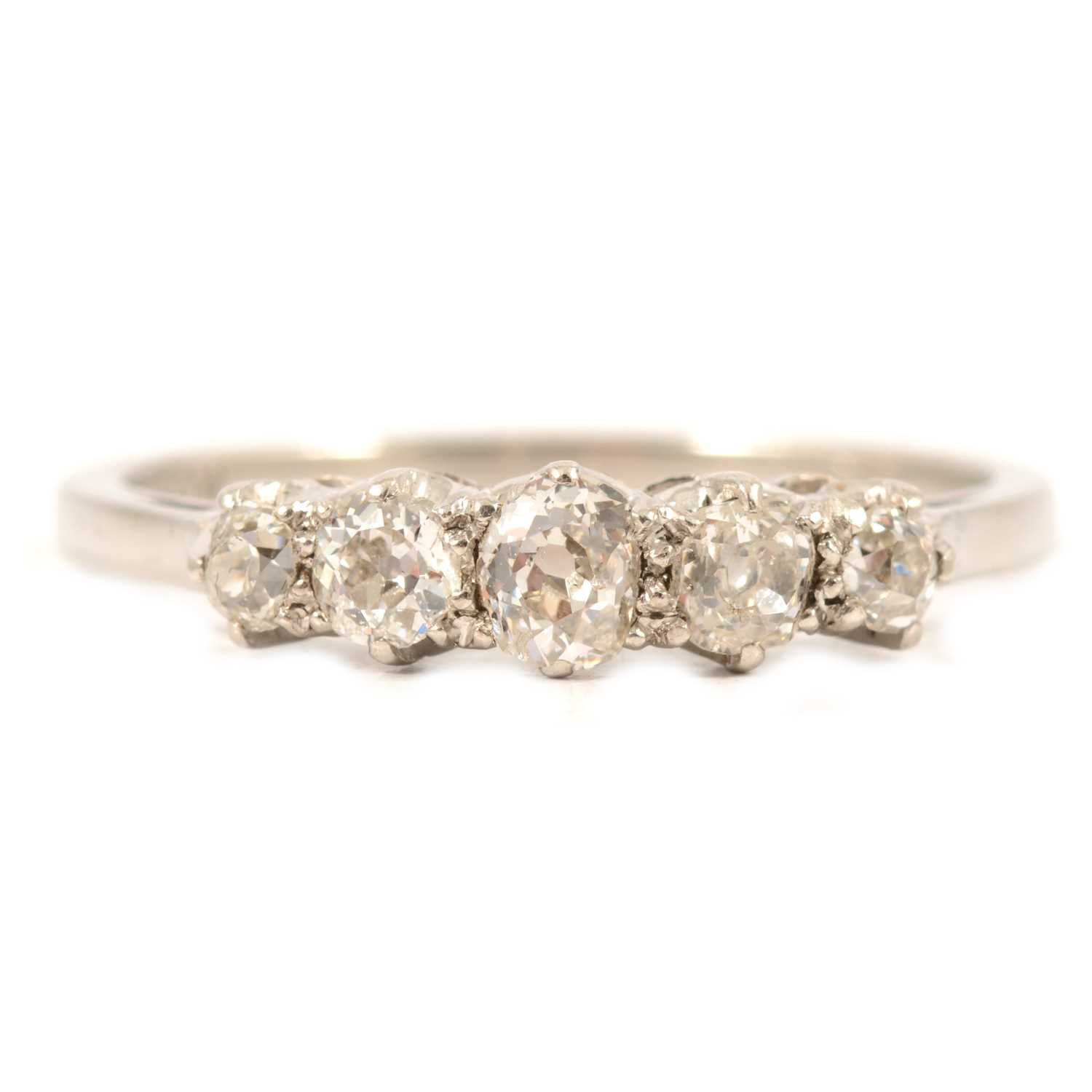 Lot 23 - A diamond five stone half hoop ring.