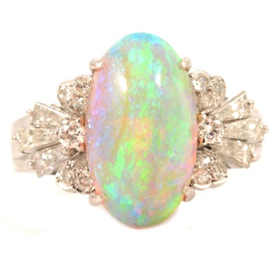 Lot 85 - An opal and diamond dress ring.