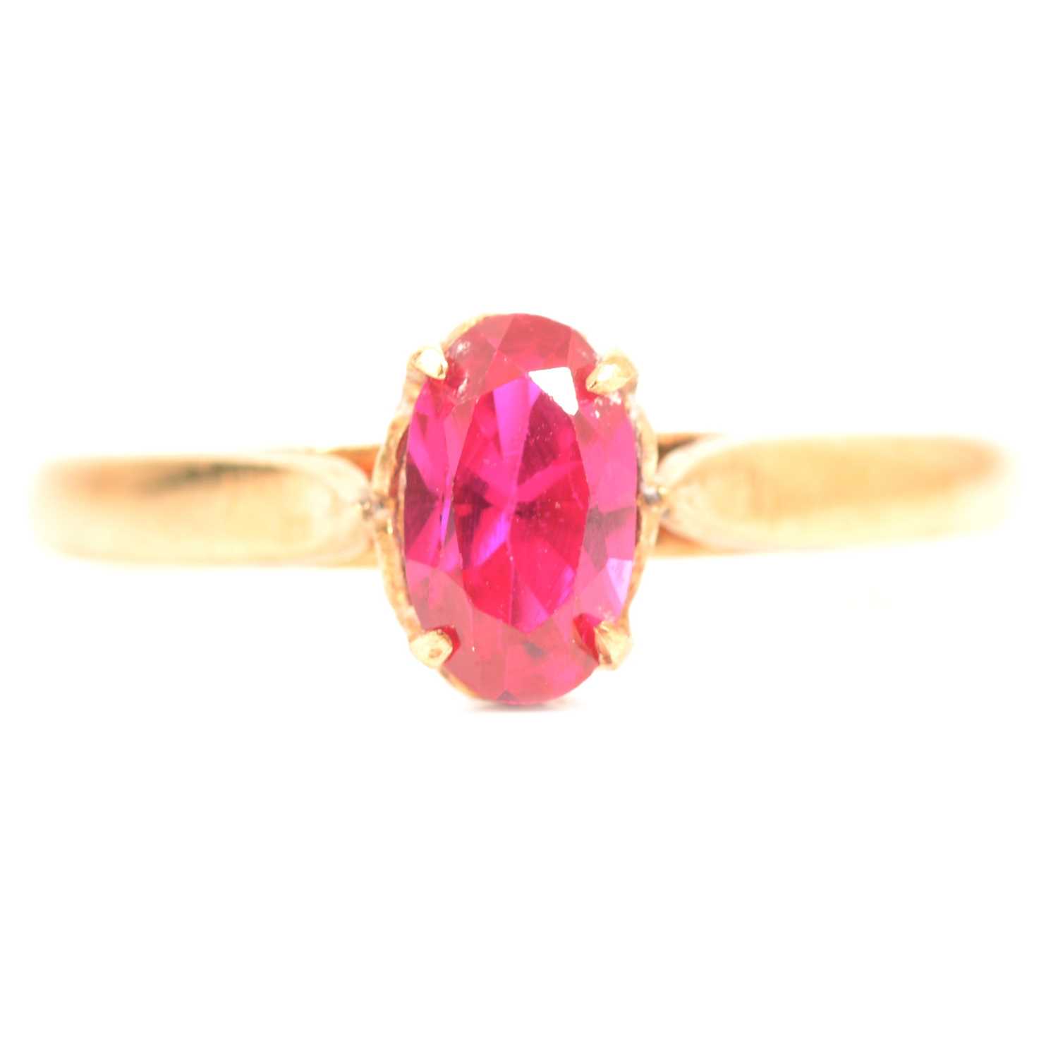 Lot 65 - A synthetic ruby solitaire ring.