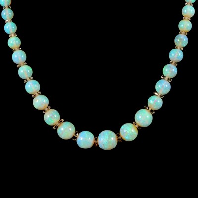 Lot 307 - An opal bead necklace.