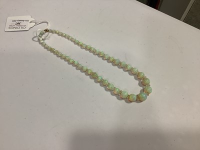 Lot 307 - An opal bead necklace.