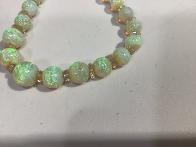 Lot 307 - An opal bead necklace.