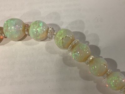 Lot 307 - An opal bead necklace.