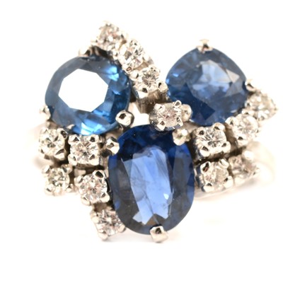 Lot 43 - A contemporary sapphire and diamond cluster ring.