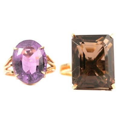 Lot 241 - A smoky quartz dress ring and an amethyst ring.