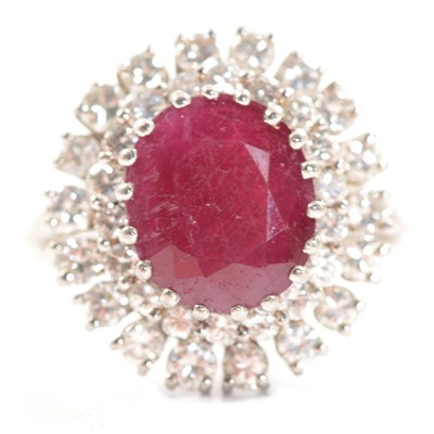 Lot 61 - A ruby and diamond cluster ring.