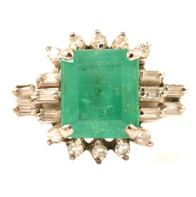 Lot 72 - An emerald and diamond ring.